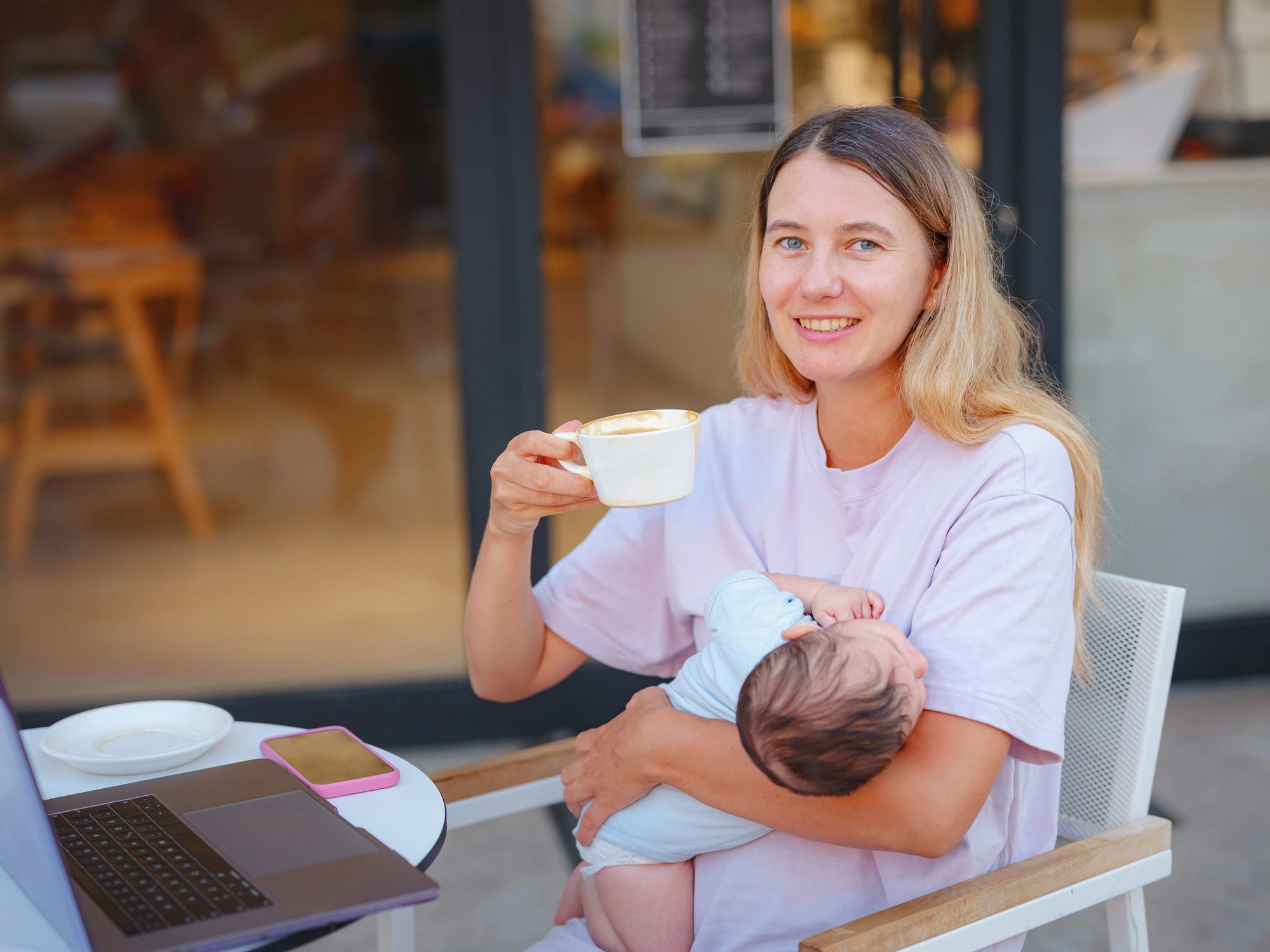 Mother caring for baby while balancing daily life