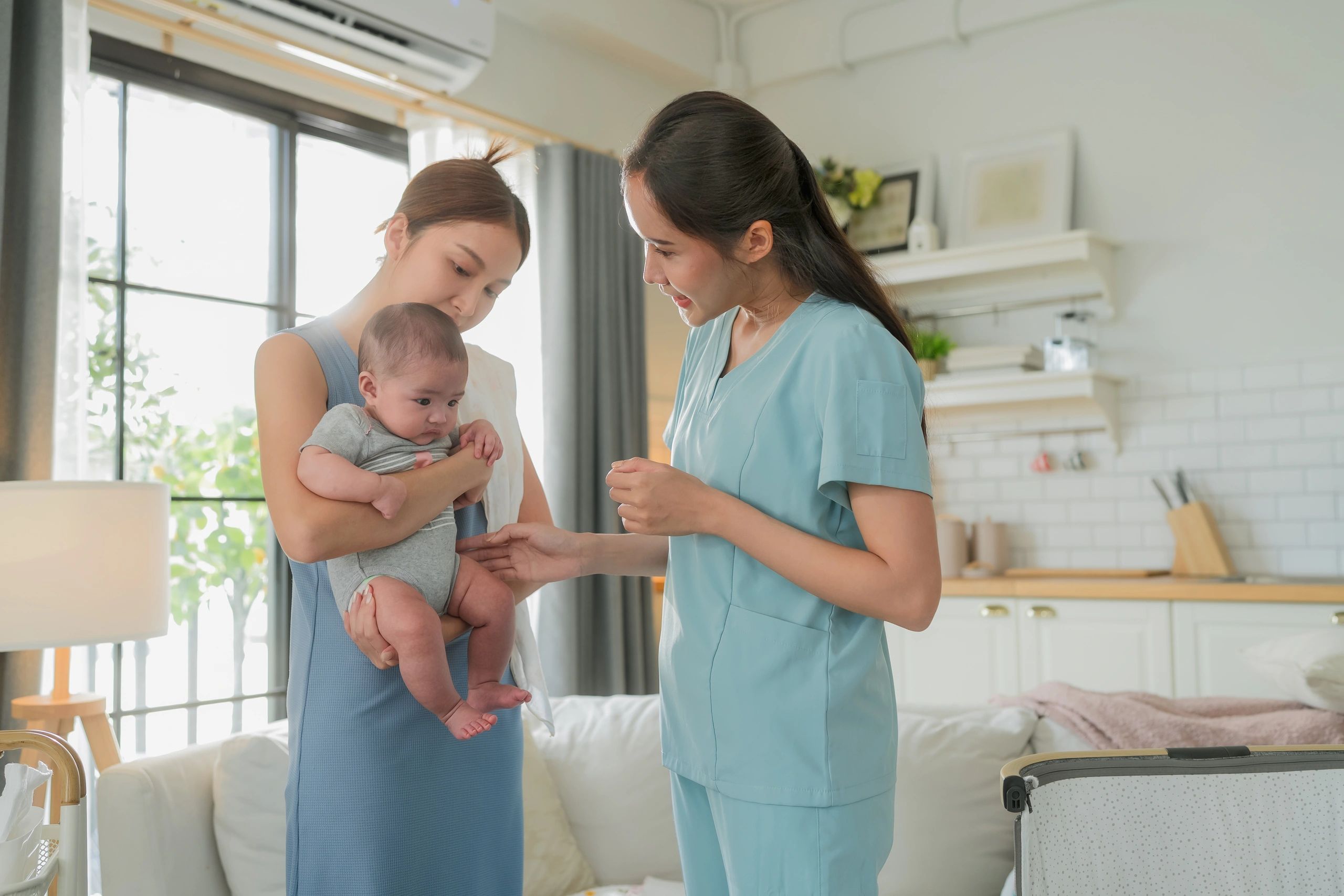 Professional infant care consultation with parent and baby